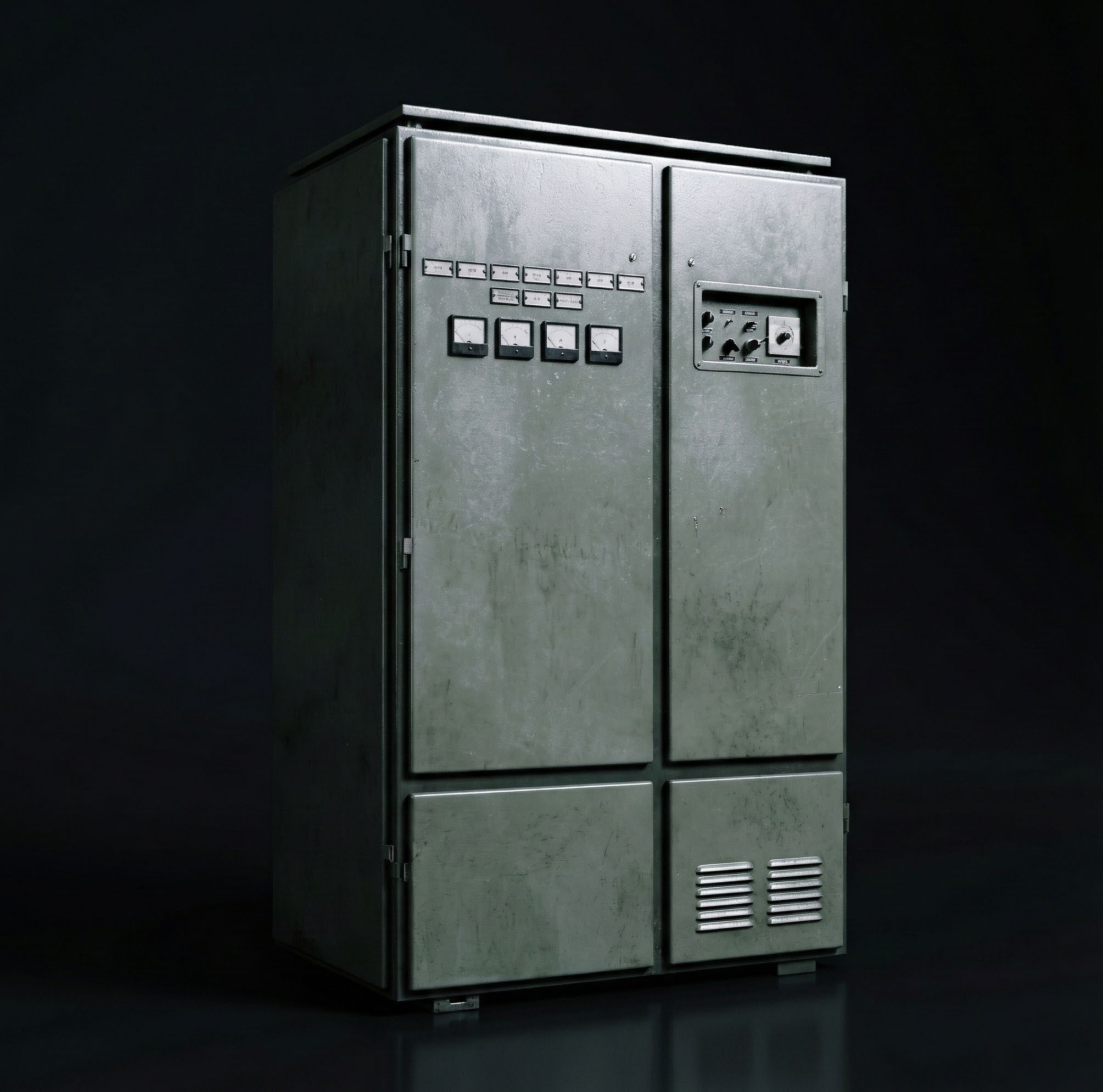Large industrial metal cabinet with control panels and vents — Powercon era