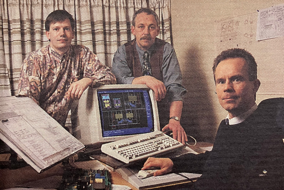 Design & development engineers reviewing an opened cabinet