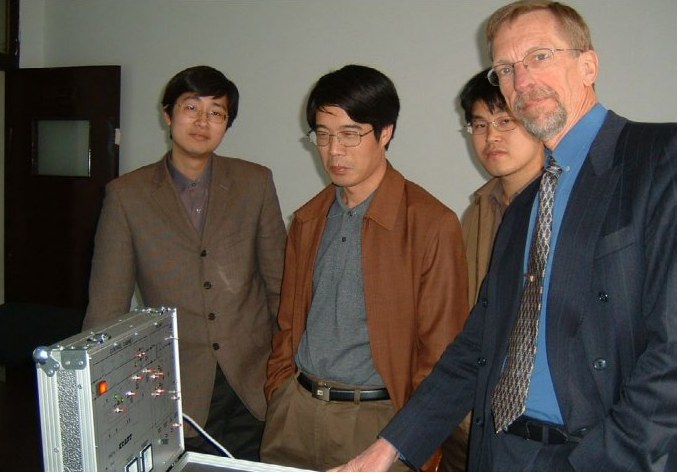 FlexKraft engineering team around the prototype, late 2000s