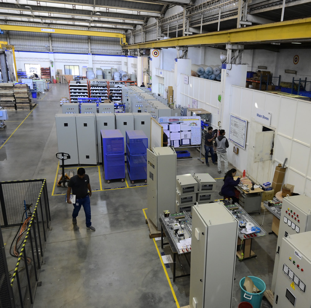 Ranjhe plant interior with cabinets and workers, 2023