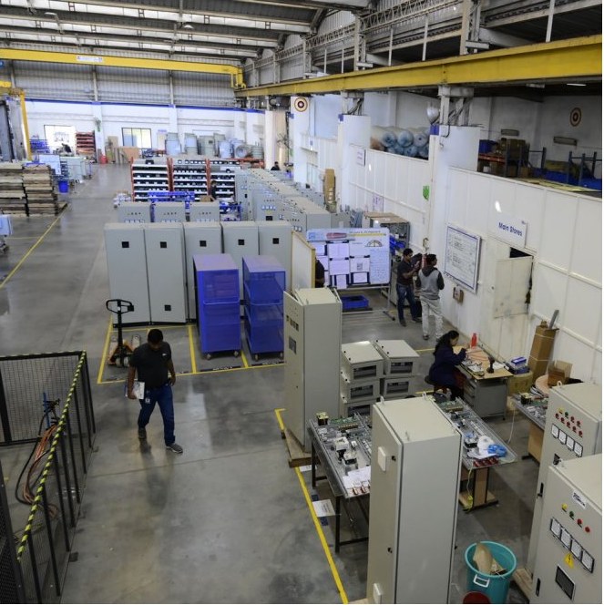 Ranjhe plant interior with cabinets and workers, 2023