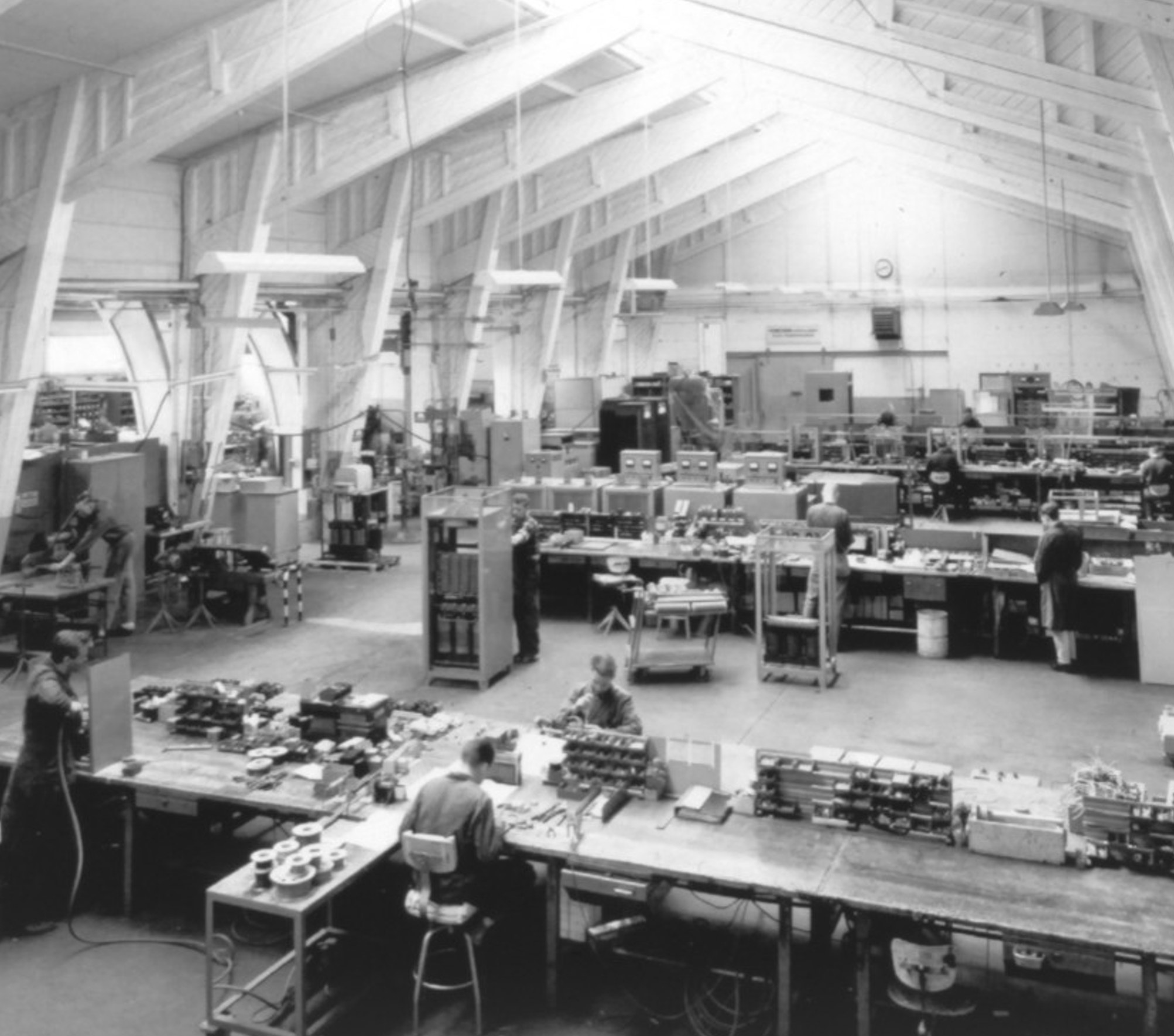 Workshop in Nol, 1966 — long benches, suspended fluorescents, transformers in progress