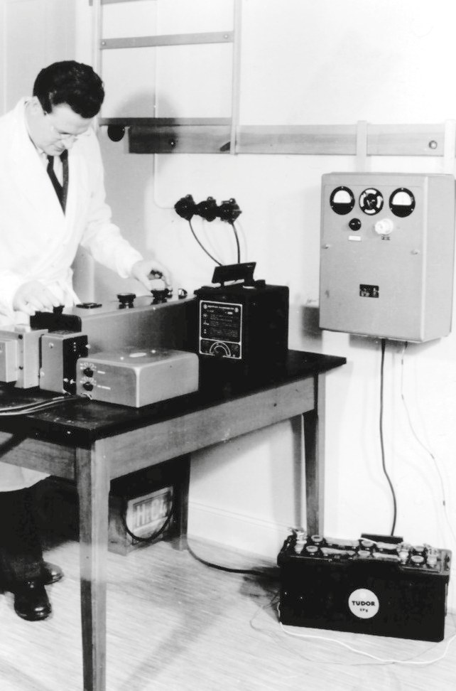 Engineer testing a rectifier on the bench, 1960s